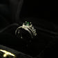 1-Carat Green Halo Gemstone Ring with Criss-Cross Diamond Band